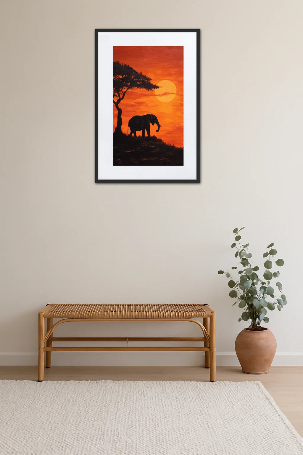 Tableau éléphant Afrique au coucher de soleil accroché au mur au-dessus d’un banc