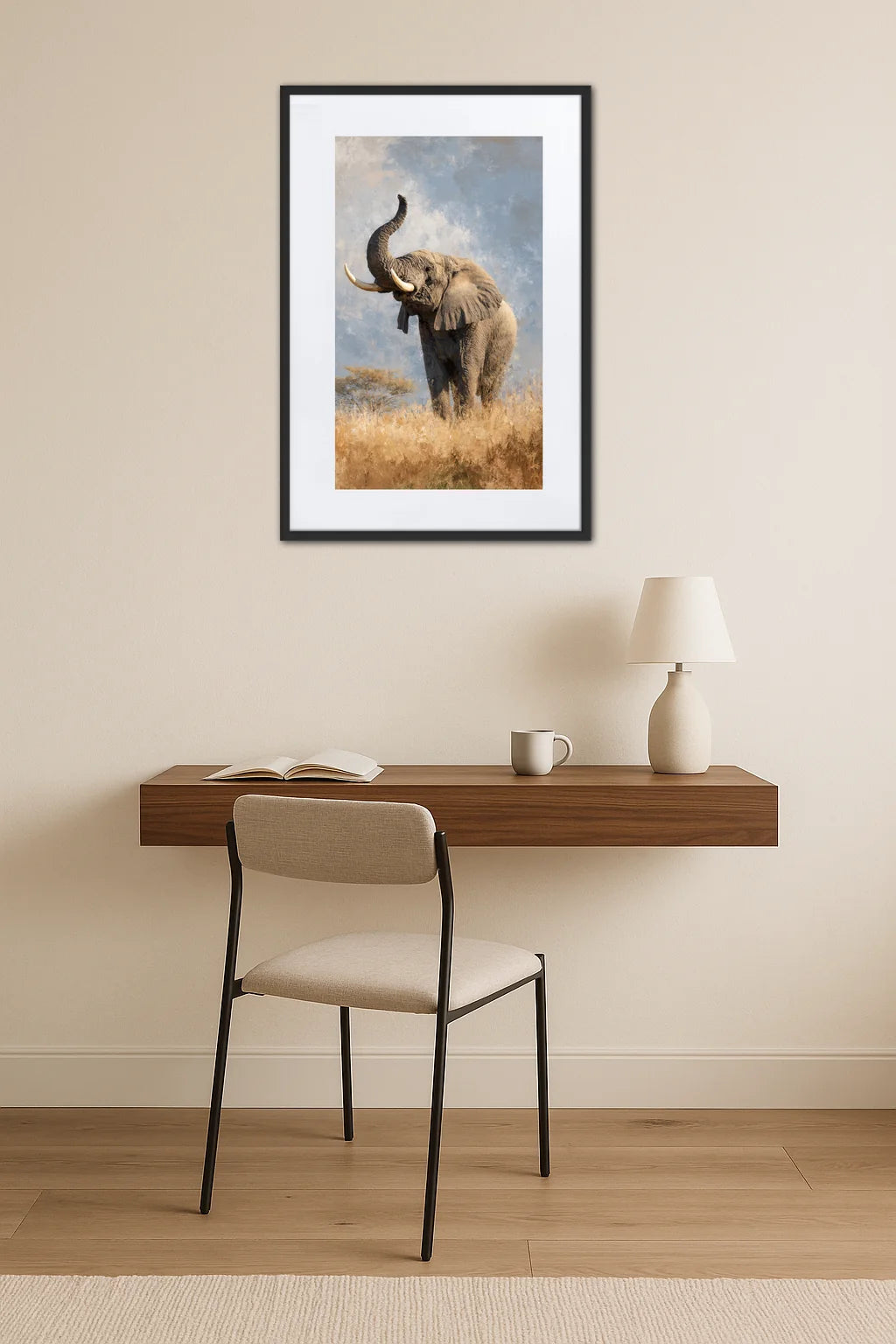 Tableau éléphant trompe en l’air accroché au mur au-dessus d’un bureau avec chaise