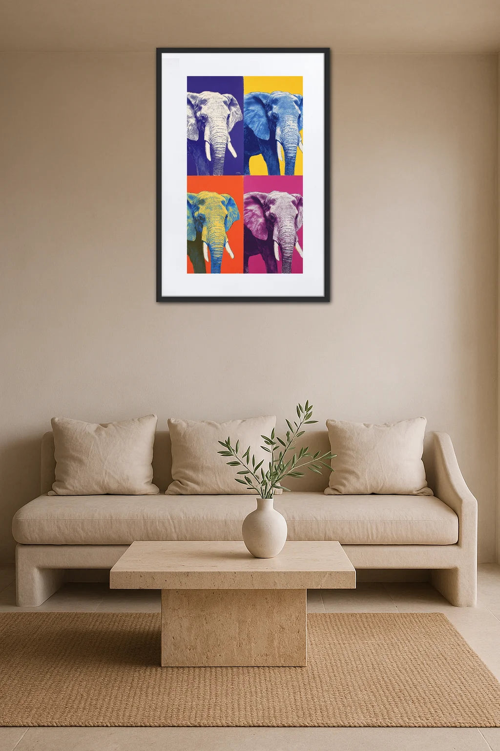 Toile éléphant pop art répétition accrochée au-dessus d’un canapé beige avec coussins, table basse en pierre et vase avec plante sur fond mural neutre
