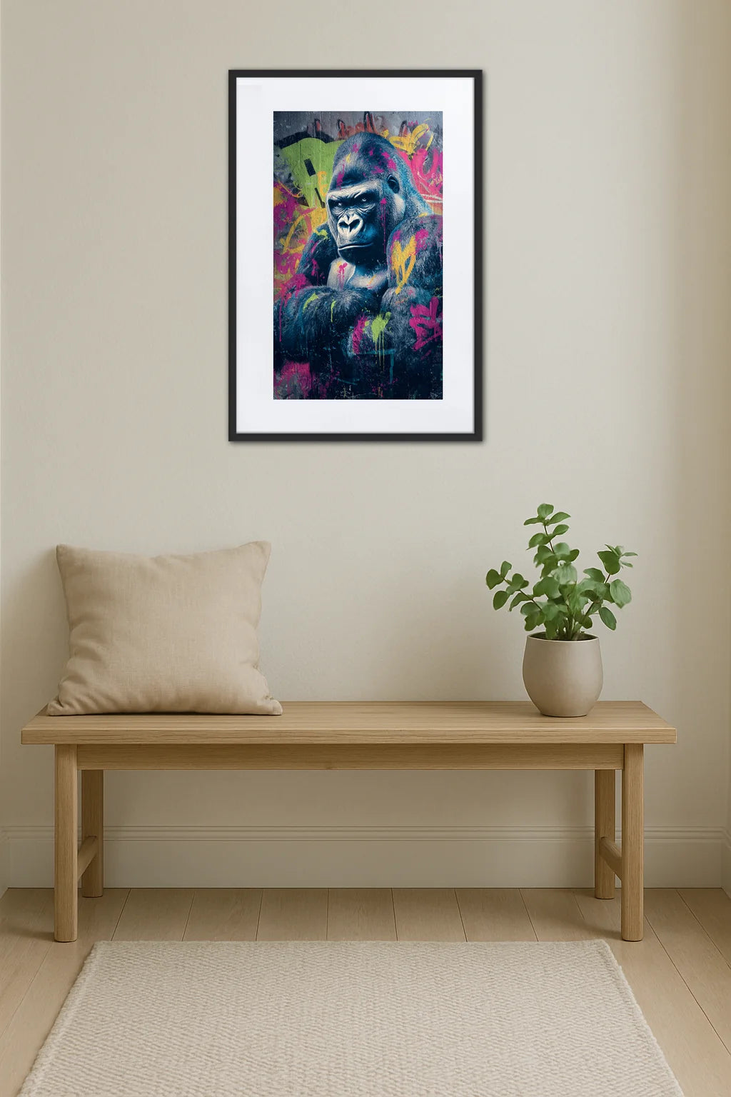 tableau gorille street art au dessus d’un banc en bois avec coussin et plante